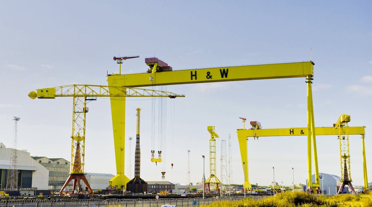 Iconic Harland & Wolff cranes stand tall in Belfast's historic shipyard.